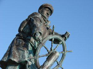 Statue of Captain at the Wheel of a ship Reframing Wellness